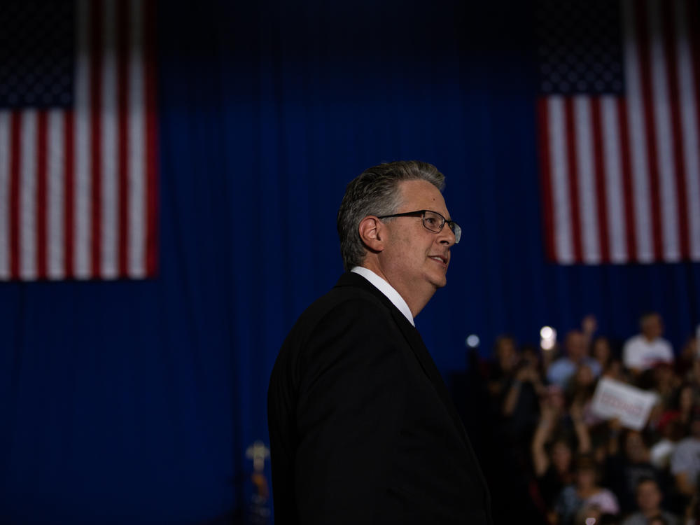 Matthew DePerno, the 2022 Republican nominee for Michigan attorney general, speaks during a Trump rally in Warren, Mich. DePerno is being investigated for his involvement in an alleged scheme to tamper with voting machines.