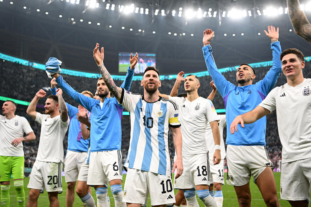 Argentina's players celebrate with their fans after the team's victory during the 2022 World Cup semifinal match with Croatia on Tuesday, Dec. 13, at the Lusail Stadium in Lusail City, Qatar.