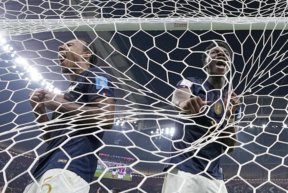 France's Jules Koundé, left, and Aurelien Tchouameni, right, celebrate their victory after a World Cup semifinal match with Morocco on Wednesday, Dec. 14, at the Al Bayt Stadium in Al Khor, Qatar. France won, 2-0.