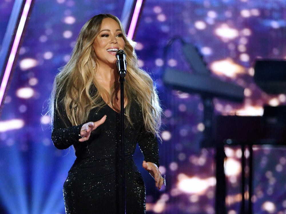 Mariah Carey, pictured performing at 2019 Billboard Music Awards, has topped the charts again with her signature Christmas hit.