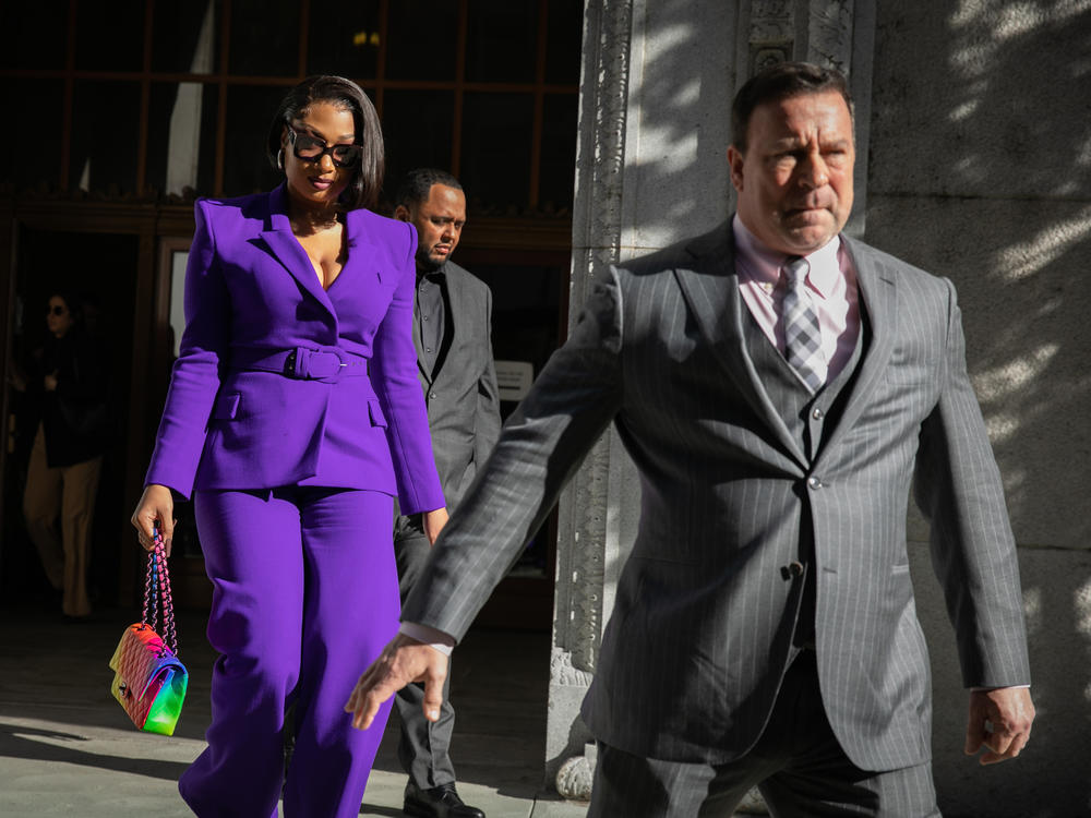 Megan Thee Stallion, whose legal name is Megan Pete, makes her way from the Hall of Justice to the courthouse to testify in the trial of Rapper Tory Lanez for allegedly shooting her on Tuesday, Dec. 13 in Los Angeles, CA.