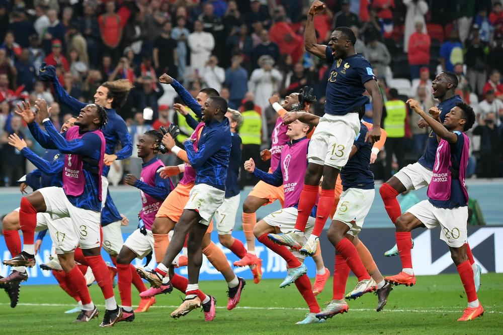 France's players celebrate their victory in a 2022 World Cup semifinal match with Morocco on Wednesday, Dec. 14, at the Al-Bayt Stadium in Al Khor, north of Doha.