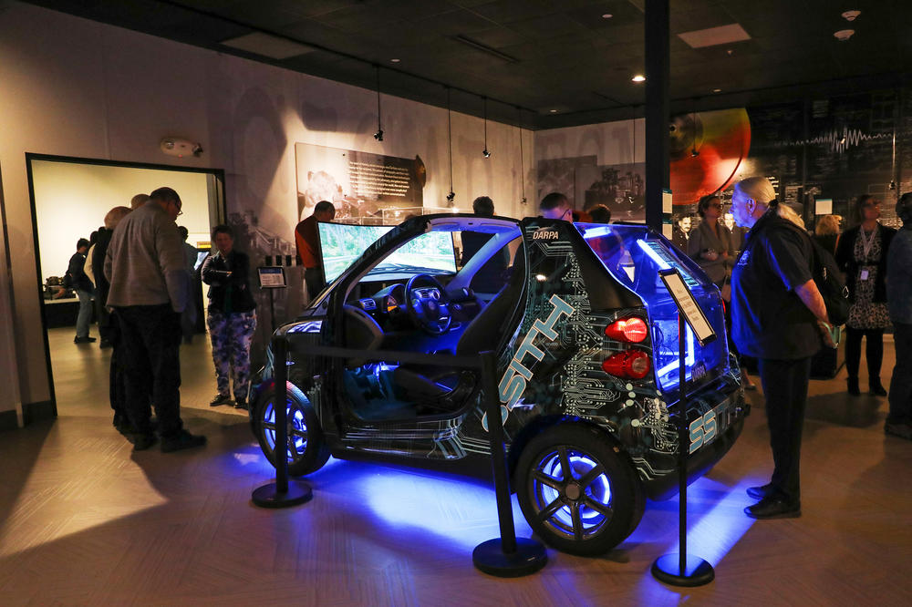 Tina Cieslowski looks at a surveillance vehicle in a wing of the National Cryptology Museum.