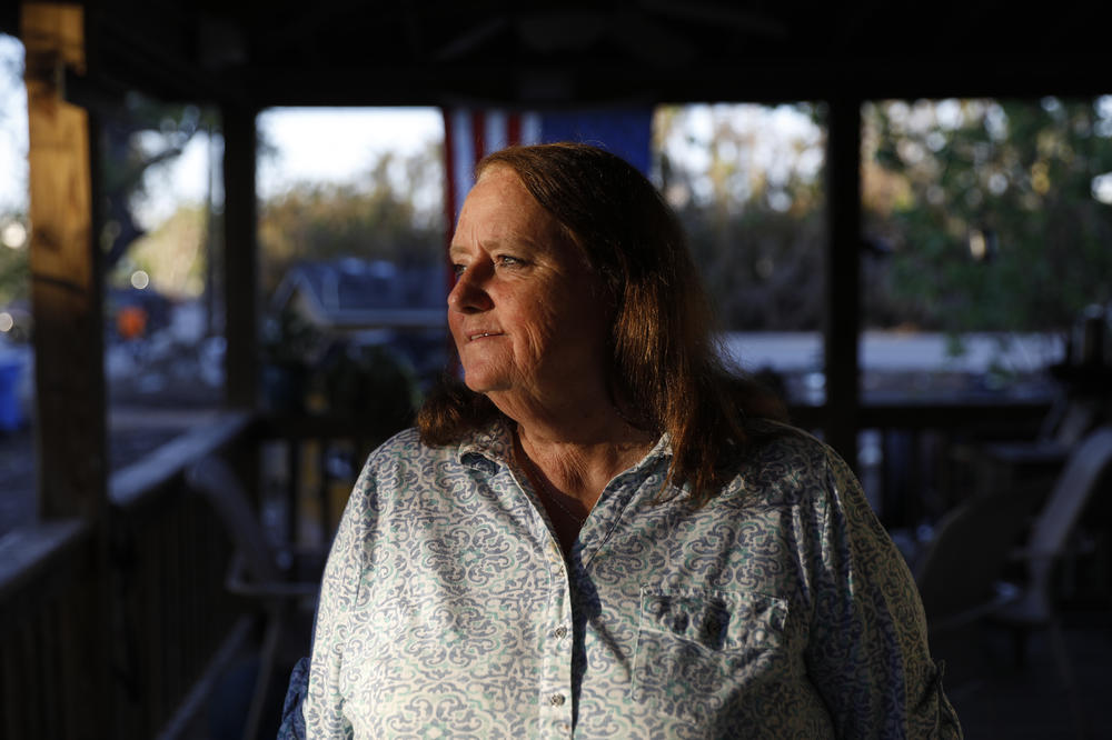 Joanne Semmer, a longtime resident of San Carlos Island, Fla., poses for a portrait at her home, which was flooded by Hurricane Ian.