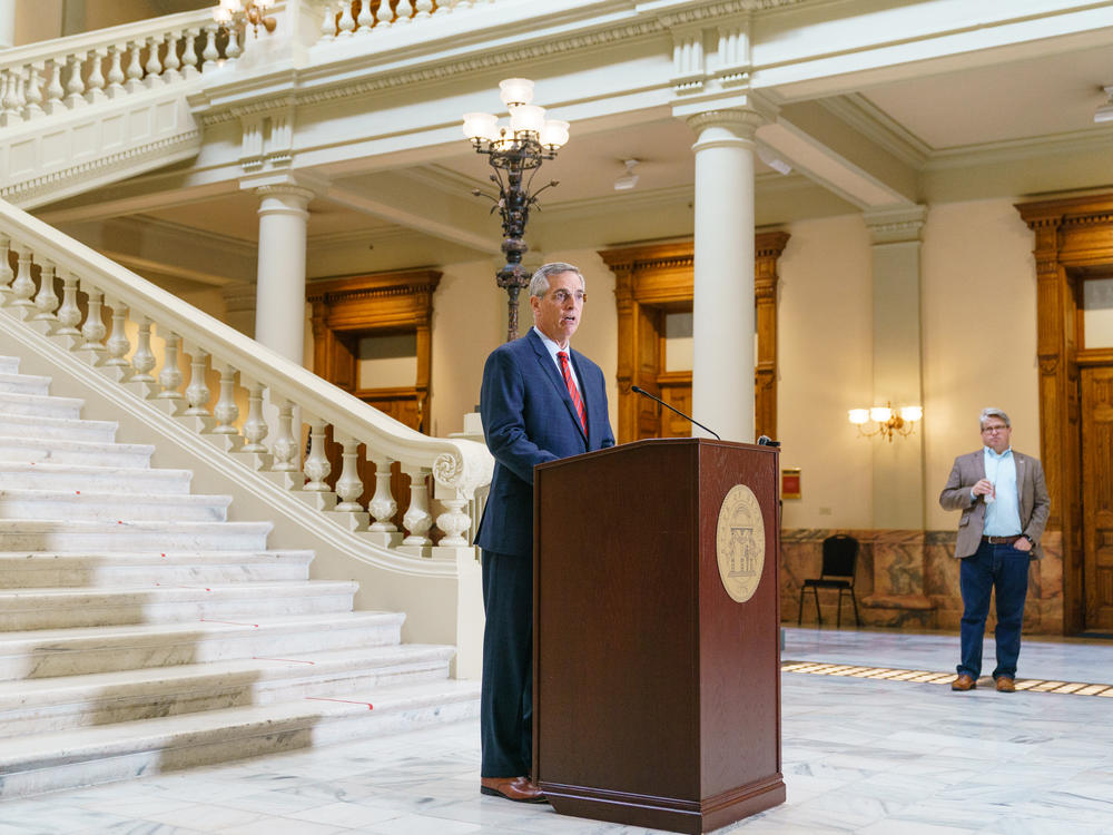 Georgia Secretary of State Brad Raffensperger, a Republican who's seen here on Oct. 25, is the ultimate decider of the state's presidential primary date. At right is Gabriel Sterling, chief operating officer in Raffensperger's office.