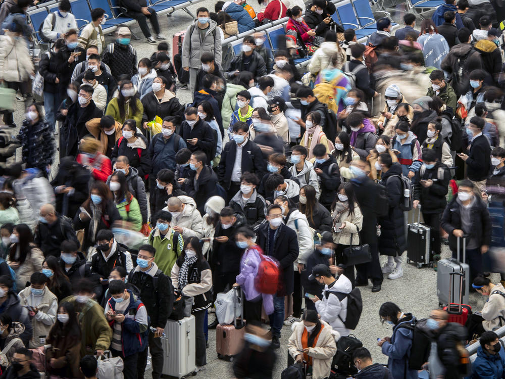 Travelers at Shanghai Hongqiao Railway Station in Shanghai, China on Dec. 12. China's public health officials say up to 800 million people could be infected with the coronavirus over the next few months.