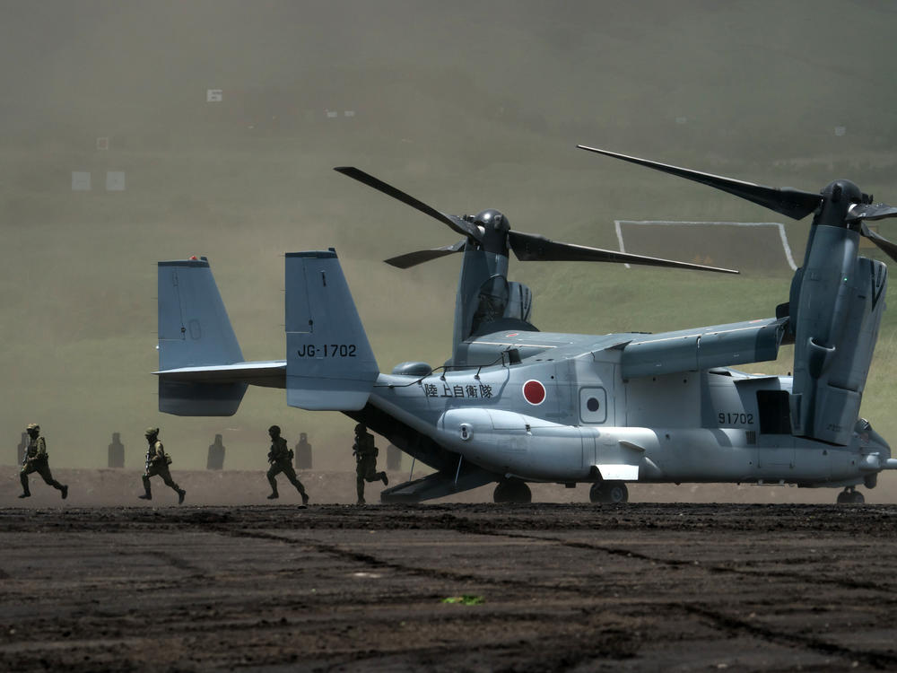 Members of the Japan Ground Self-Defense Force disembark from a V-22 Osprey aircraft during a live-fire exercise at East Fuji Maneuver Area in Gotemba, Shizuoka prefecture, Japan, on May 28. The annual live-fire drill took place as Japanese Prime Minister Fumio Kishida pledged to boost defense spending after a summit with U.S. President Biden and other 