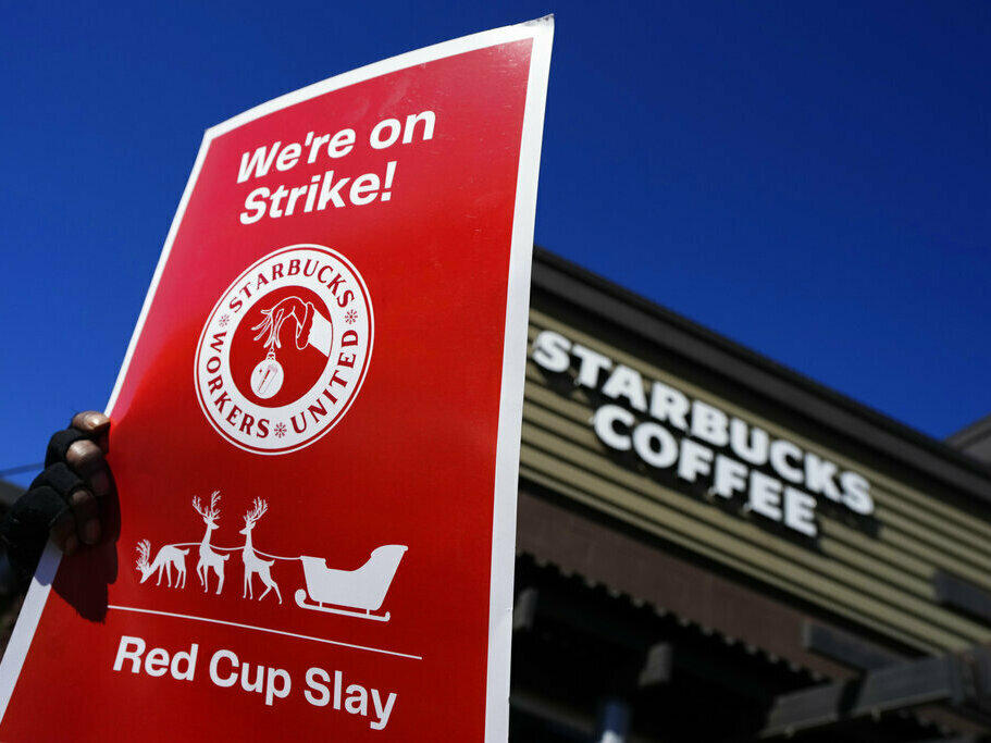 Starbucks employees strike Nov. 17 outside their store in Mesa, Ariz. Starbucks workers around the U.S. are planning a three-day strike starting Friday as part of their effort to unionize the coffee chain's stores.