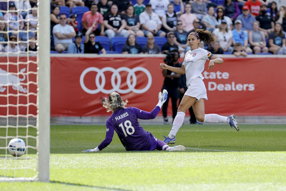 Alex Morgan of San Diego Wave FC scores past Ashlyn Harris of NY/NJ Gotham FC in a National Women's Soccer League game last summer.
