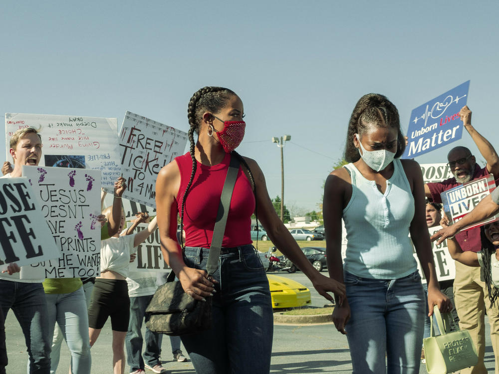 In an episode of<em> P-Valley</em> (Starz), Mercedes (Brandee Evans) and her daughter Terricka (A'zaria Carter) face protesters outside an abortion clinic.