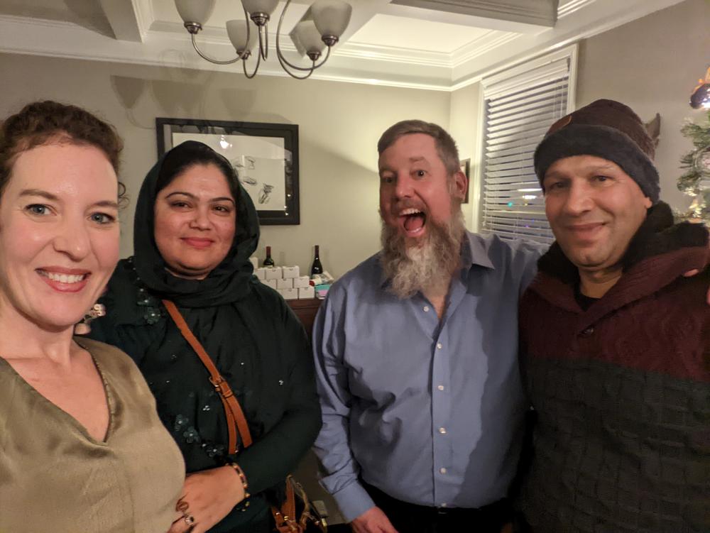 Julie Johnson, Sharifa Ghafoori, Ben Johnson, Homayoon Ghafoori. Julie and Ben Johnson organized a group of private sponsors to help the Ghafooris resettle in Huntsville, Alabama.