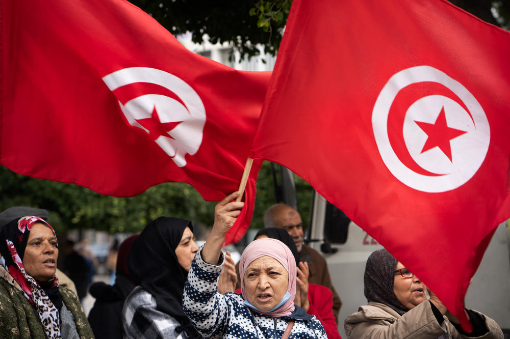 People wave flags and chant at a protest against President Kais Saied last week.