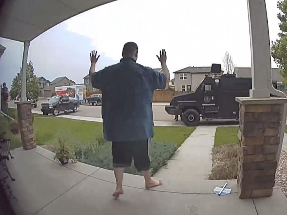 In this image from video, Anderson Aldrich surrenders to police at a home where his mother was renting a room in Colorado Springs, Colo., on June 18, 2021.