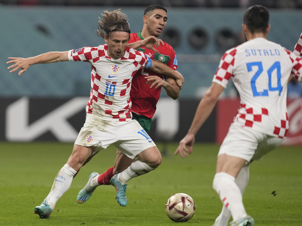 Croatia's Luka Modrić in action in front of Morocco's Achraf Hakimi during the World Cup third-place playoff match between Croatia and Morocco at Khalifa International Stadium in Doha, Qatar on Saturday.