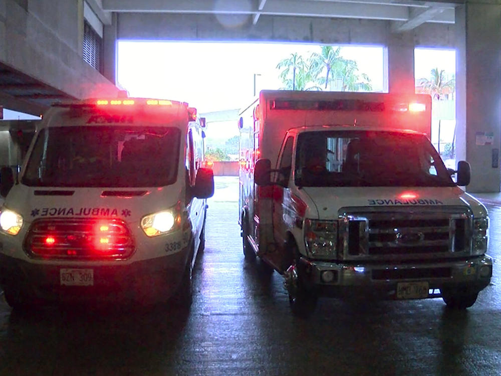 In this image taken from a video provided by Hawaii News Now, ambulances remain outside the international airport in Honolulu after multiple people were seriously injured when a flight to Hawaii hit severe turbulence  Sunday.