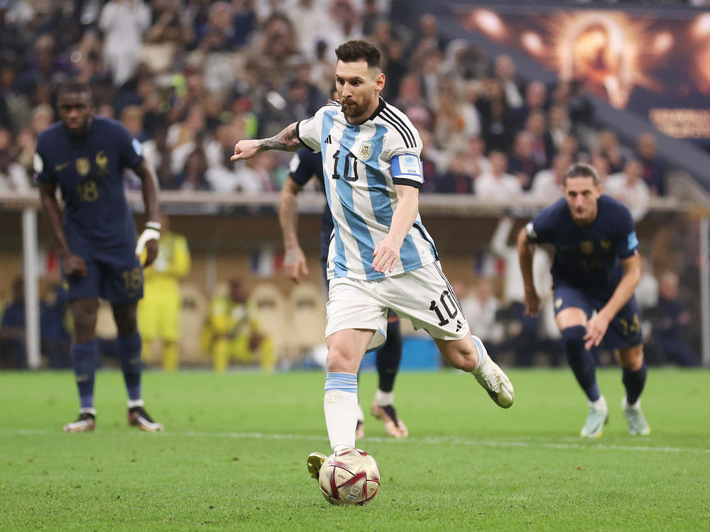 Lionel Messi of Argentina scores the team's first goal from the penalty spot during the FIFA World Cup Qatar 2022 Final match between Argentina and France at Lusail Stadium on December 18, 2022 in Lusail City, Qatar.