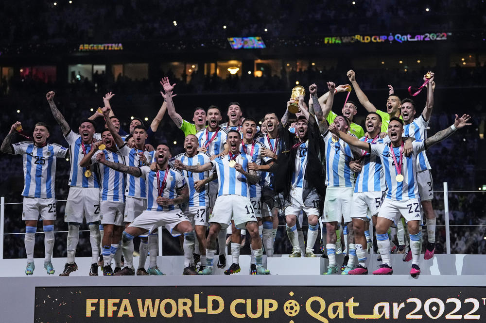 Argentina's Lionel Messi holds up the winner's trophy after the team won the 2022 World Cup final against France on Sunday, Dec. 18, at the Lusail Stadium in Lusail, Qatar.
