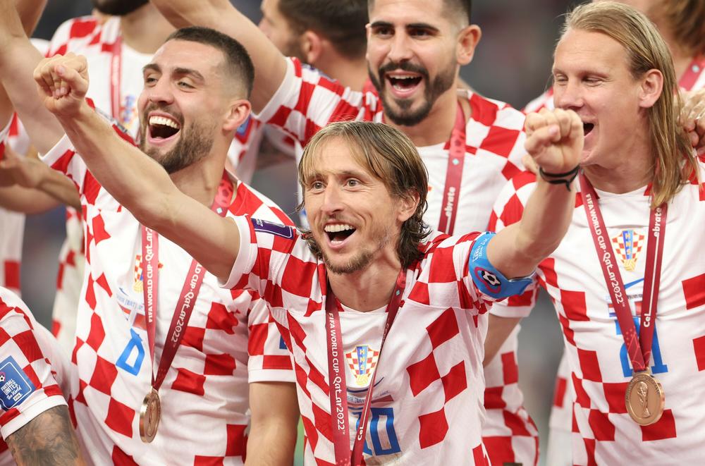 Croatia's Luka Modrić celebrates with his teammates after the team' secured a third-place finish in the 2022 World Cup play-off match with Morocco on Saturday, on Dec. 17, at Khalifa International Stadium in Doha, Qatar.