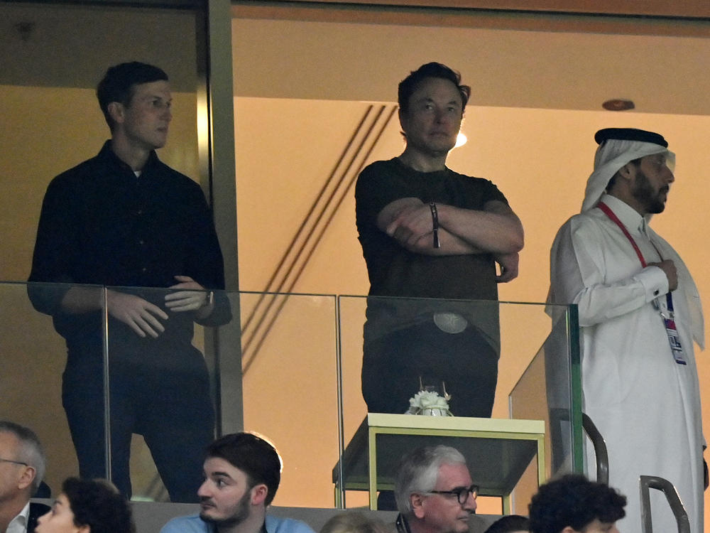 Elon Musk (center), standing with former President Trump's son-in-law Jared Kushner (left) look on during the World Cup Final between Argentina and France in Qatar on December 18.