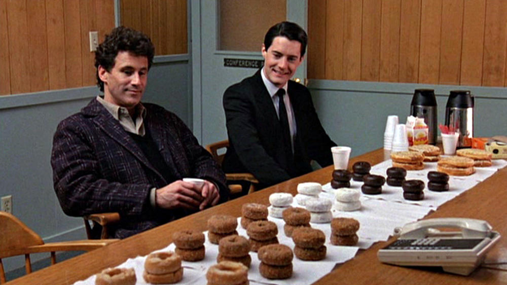 A still from the pilot episode of <em>Twin Peaks</em>, featuring Michael Ontkean as Sheriff Harry S. Truman (left) and Kyle MacLachlan as Special Agent Dale Cooper.
