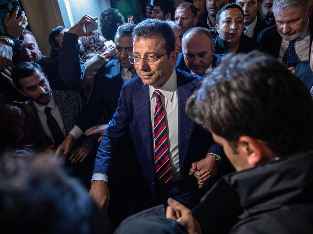 Mayor Ekrem Imamoglu leaves a rally in front of the Istanbul Metropolitan Municipality building in Istanbul on Dec. 14, following a Turkish court decision to sentence him to two years and seven months in prison for insulting election officials.