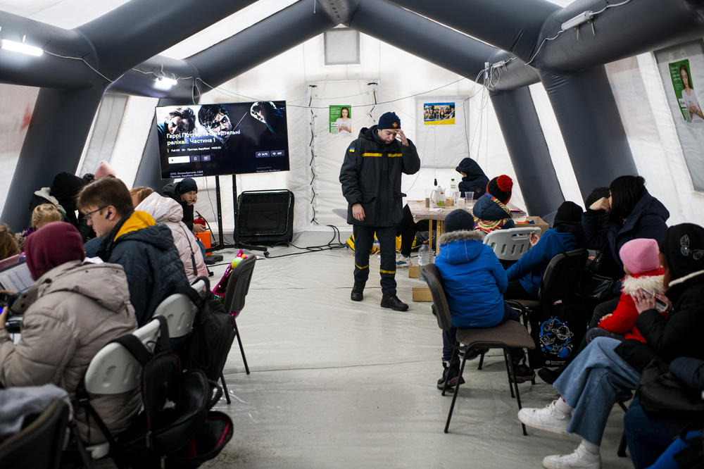 A tent set up by Ukrainian authorities offers shelter, heat, WiFi and charging stations to the public in Bucha on Dec. 2. Authorities refer to these tents as 