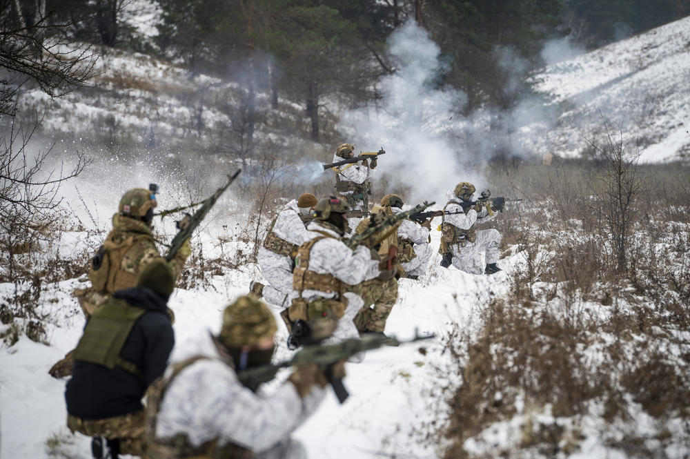 Members of Ukraine's Dzhokhar Dudayev Battalion fire a rocket-propelled grenade while training with new recruits outside Kyiv on Dec. 3.