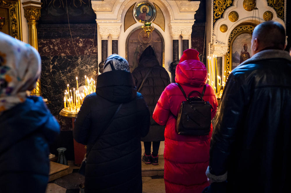 Worshipers wait to pray at icons during a Sunday Mass celebrating the Presentation of the Virgin Mary at St. Volodymyr's Cathedral in Kyiv on Dec. 4.
