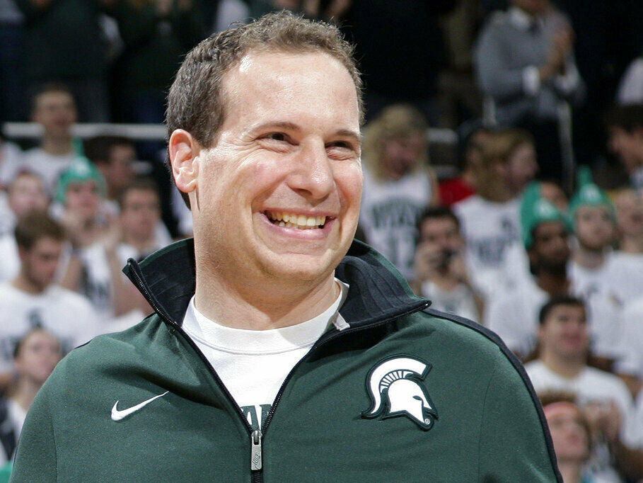 Former Michigan State player Mat Ishbia laughs as he's introduced along with Michigan State's 2000 national championship NCAA college basketball team during halftime of the Michigan State-Florida game in East Lansing, Mich. The mortgage executive has agreed in principle to buy the Phoenix Suns and Phoenix Mercury from the embattled owner Robert Sarver for $4 billion.