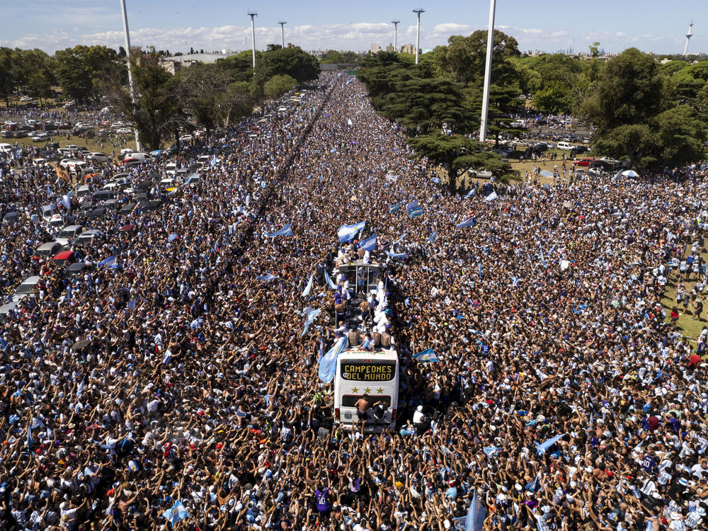 The Argentine soccer team that won the World Cup title ride on an open bus during their homecoming parade in Buenos Aires, Argentina, Tuesday, Dec. 20, 2022.