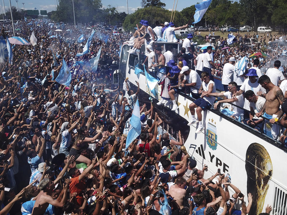 Soccer fans welcome home the Argentine soccer team after it won the World Cup tournament in Buenos Aires, Argentina, Tuesday, Dec. 20, 2022.