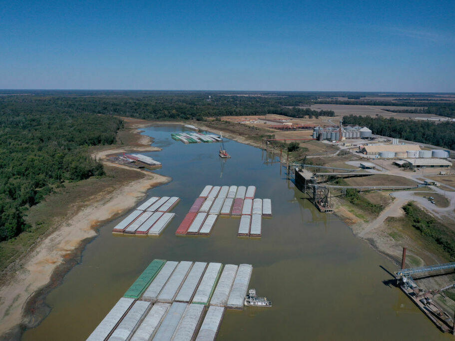 Barges were stranded by low water levels along the Mississippi River in October, driving up shipping prices and threatening crop exports and fertilizer shipments. Scientists at the University of Memphis expect more dramatic swings in water levels on the river due to climate change.