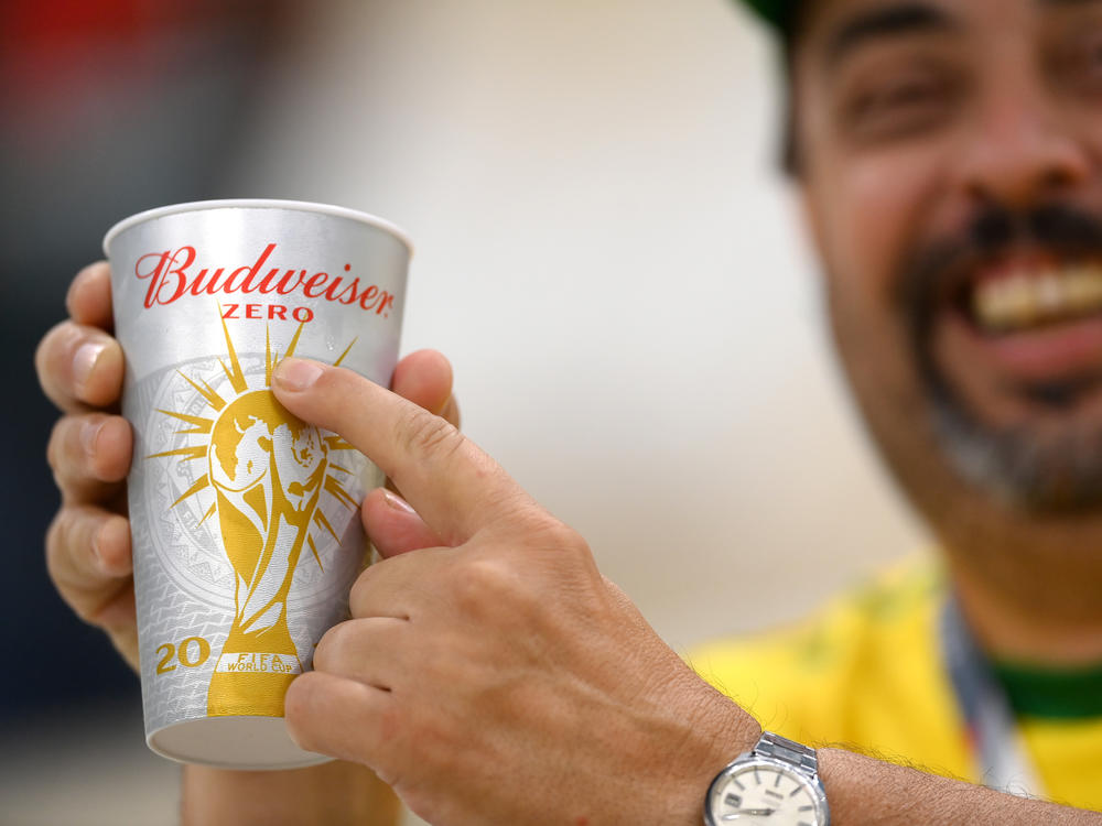 A Brazil fan points to 