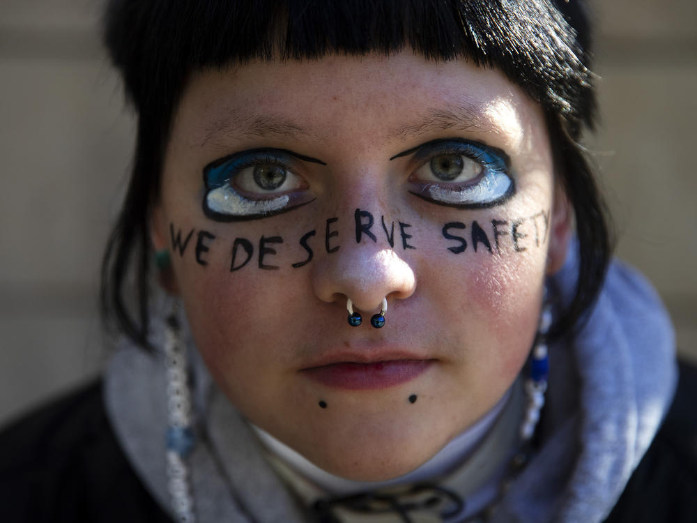 E.O., a sophomore at Ingraham high school is portrayed with the words 'we deserve safety' painted on their face during a student walkout to protest gun violence in schools on Monday, November 14, 2022, at Seattle City Hall. Full story <a href=