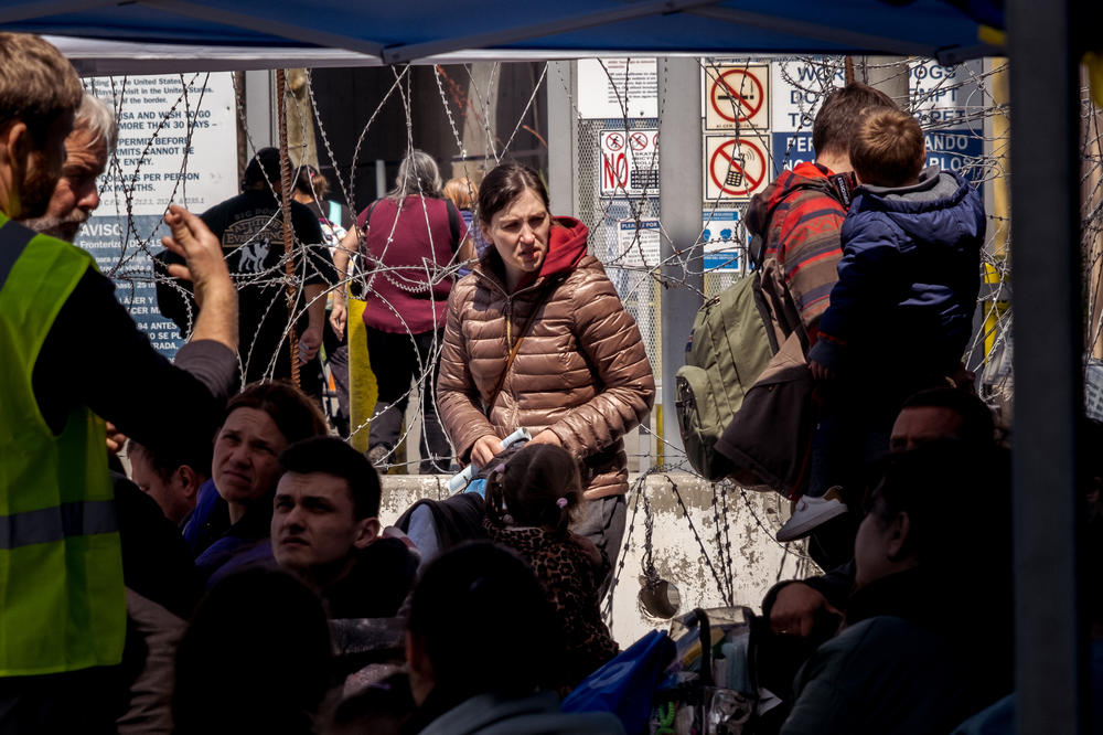Ukrainian war refugees wait at the border crossinginto the United States from Tijuana for their turn to request asylum. Full story <a href=