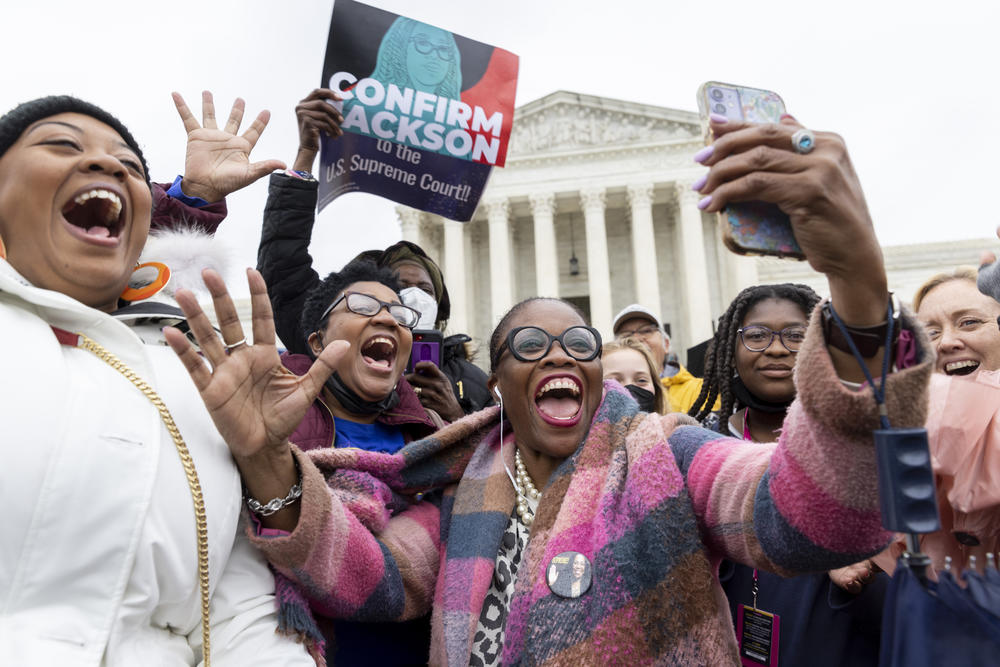 <strong>From left to right</strong>: Nicole Tinson from L.A., Teresa Roberts, from Shannon, Mississippi, Sheila Carson, from D.C. and Regina Langley, middle, from New Jersey. Langley was holding a cell phone watching the Senate voting on the conformation of Ketanji Brown Jackson to the Supreme Court. Full story <a href=
