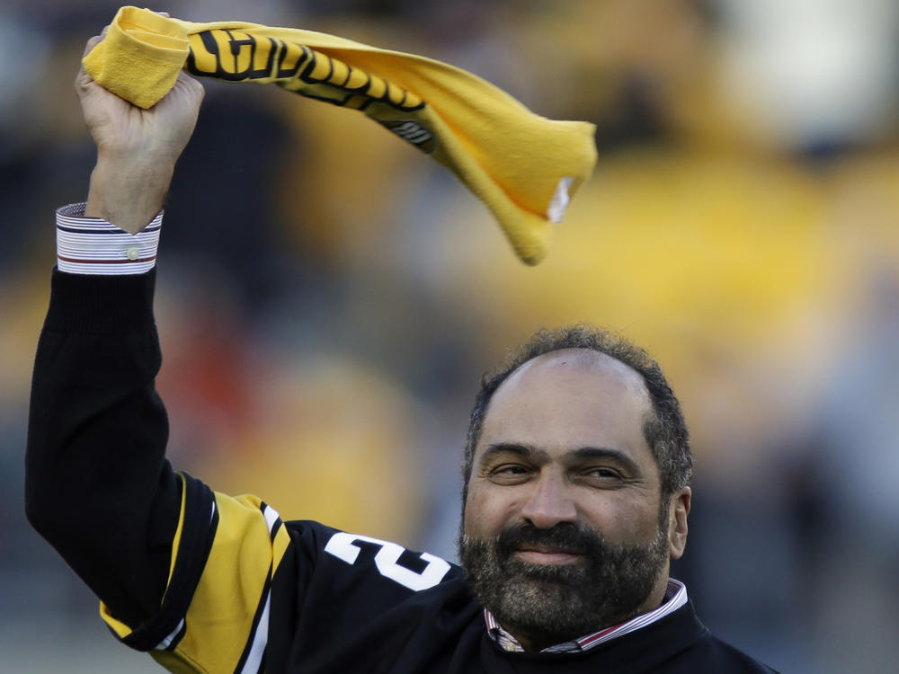 Pittsburgh Steelers Hall of Fame running back Franco Harris twirls a Terrible Towel during a ceremony on Dec. 23, 2012, commemorating the 40th anniversary of his 