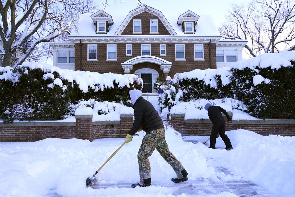 Shoveling snow in Minneapolis on Thursday.