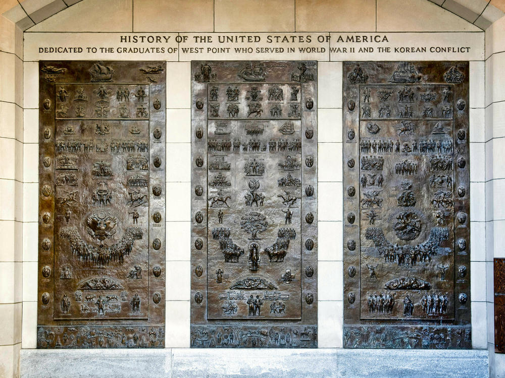 Three bronze panels at one of the entrances to Bartlett Hall, at West Point depict the history of the United States. In coming days, the U.S. military academy will begin taking down memorials commemorating figures of the Confederacy.