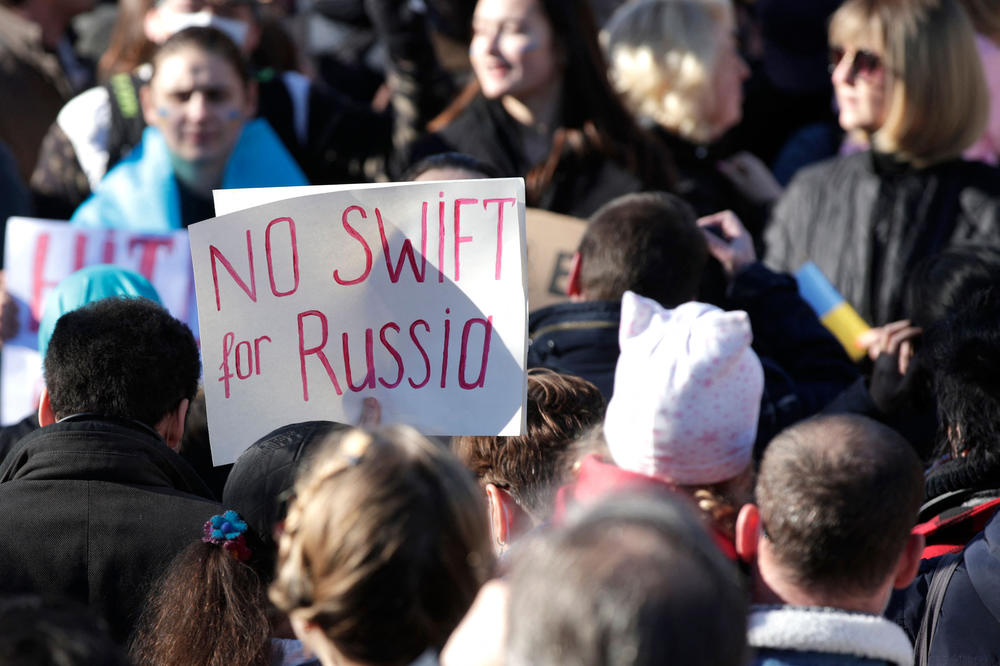 A protester holds a sign during a rally against Russia's invasion of Ukraine, at Place de la Republique in Paris, on Feb. 26.