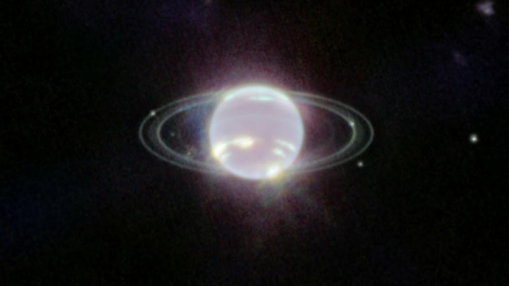 This is the clearest view of Neptune's rings in decades, taken by JWST. Observed here in near-infrared wavelengths, Neptune appears ghostly white instead of blue.