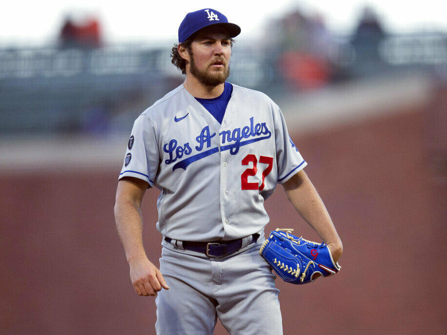 Los Angeles Dodgers starting pitcher Trevor Bauer pauses in May 2021 while working against the San Francisco Giants in San Francisco.