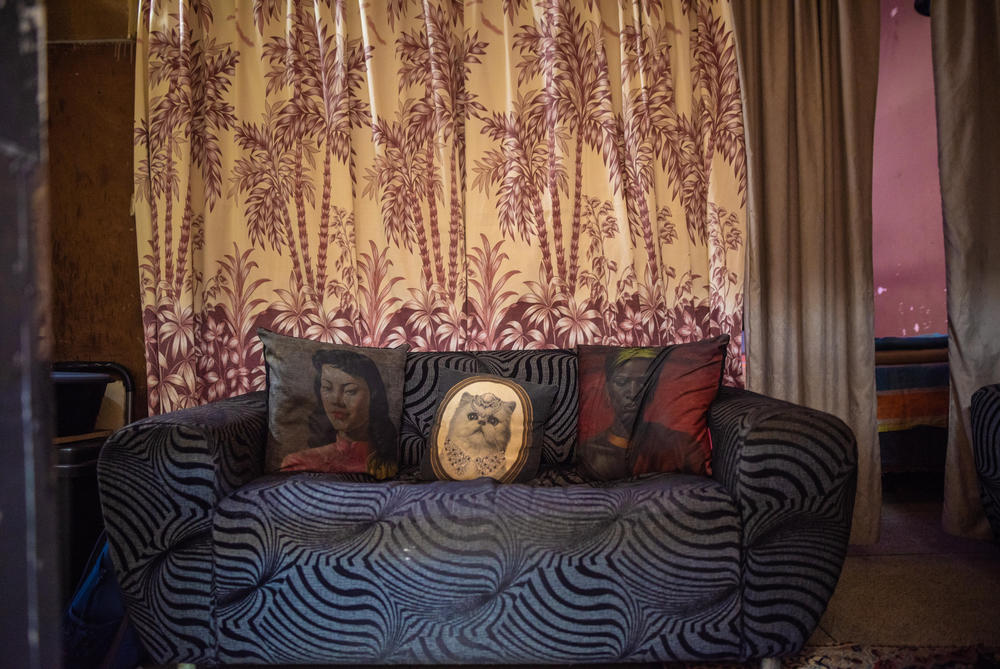 A sofa in the home of Elizabeth Daniels and her family in Cissie Gool House. Many residents have used furniture to create seperate living spaces in former in-patient accommodations and consulting rooms.