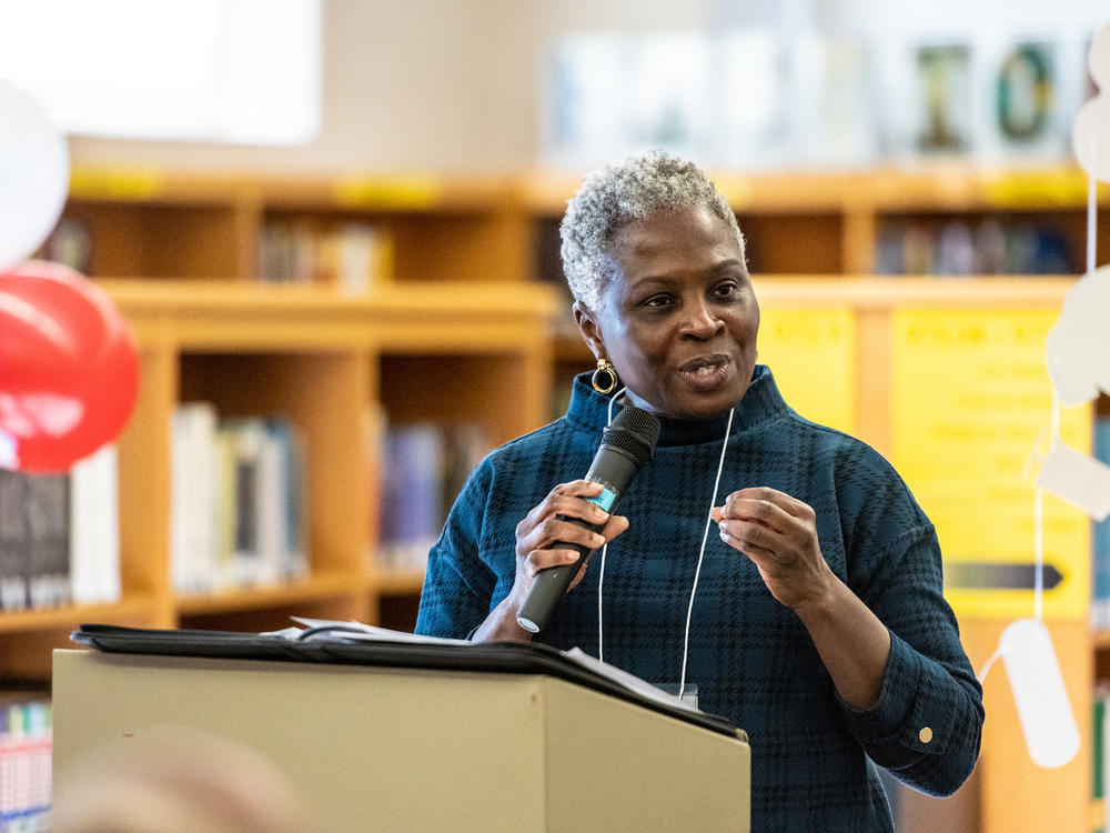 Dr. Gloria Addo-Ayensu, director of the Fairfax County Health Department, spoke with students graduating from the Public Health Youth Ambassador Program at the John Lewis High School library.