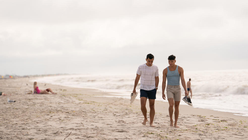 Conrad Ricamora and Joel Kim Booster in <em>Fire Island</em>.