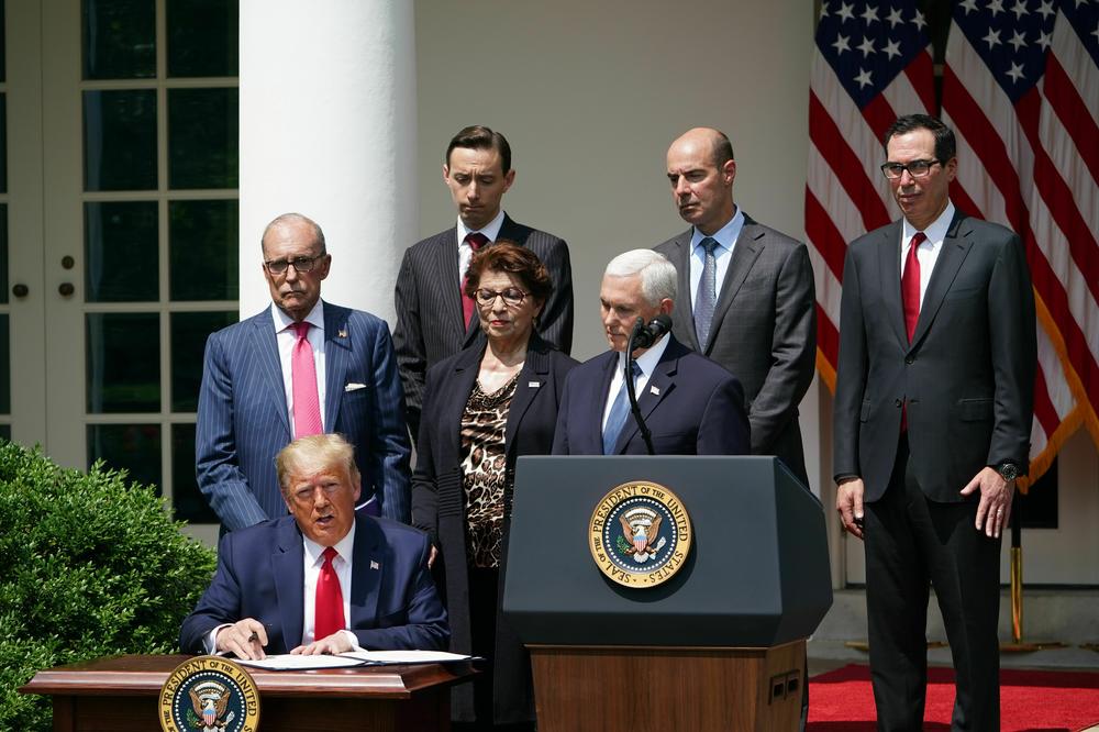 President Donald Trump speaks to reporters while signing the Paycheck Protection Program Flexibility Act on June 5, 2020.