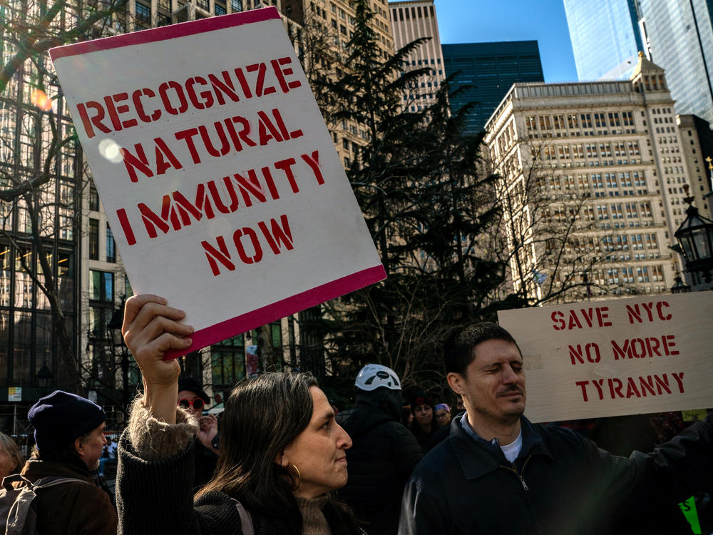 People gather at City Hall to protest New York City's vaccine mandate for public employees on Feb. 11, the day that many were fired.