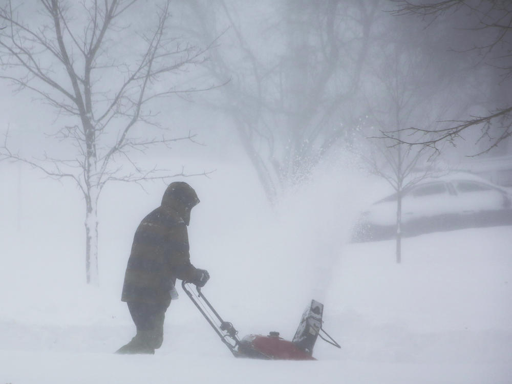 A winter storm rolls through Amherst, N.Y., on Saturday. Power has been knocked out power to hundreds of thousands of homes and businesses across the country.