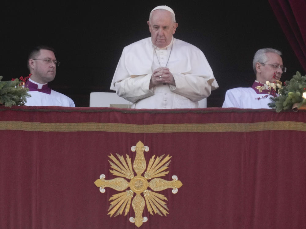 Pope Francis delivers the Urbi et Orbi (Latin for 'to the city and to the world') Christmas day blessing from the main balcony of St. Peter's Basilica at the Vatican on Sunday.