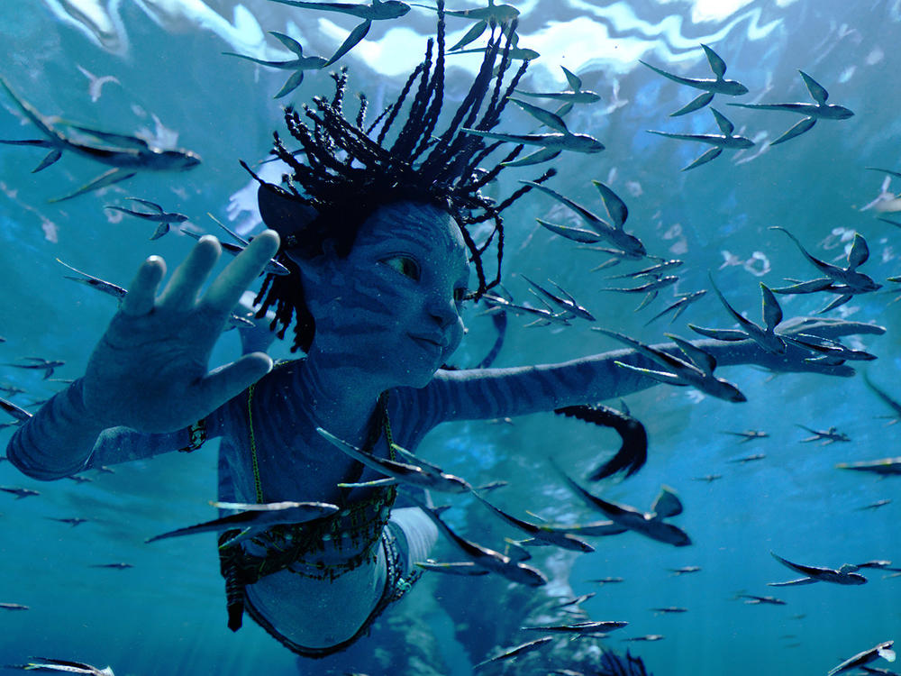This image released by 20th Century Studios shows Trinity Bliss, as Tuk, in a scene from <em>Avatar: The Way of Water</em>.